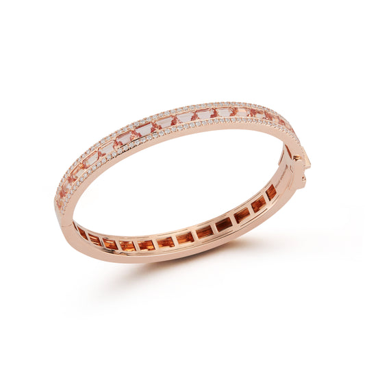 An 18K rose gold bangle bracelet with Imperial Topaz and White Diamonds set in a pattern around the circumference.